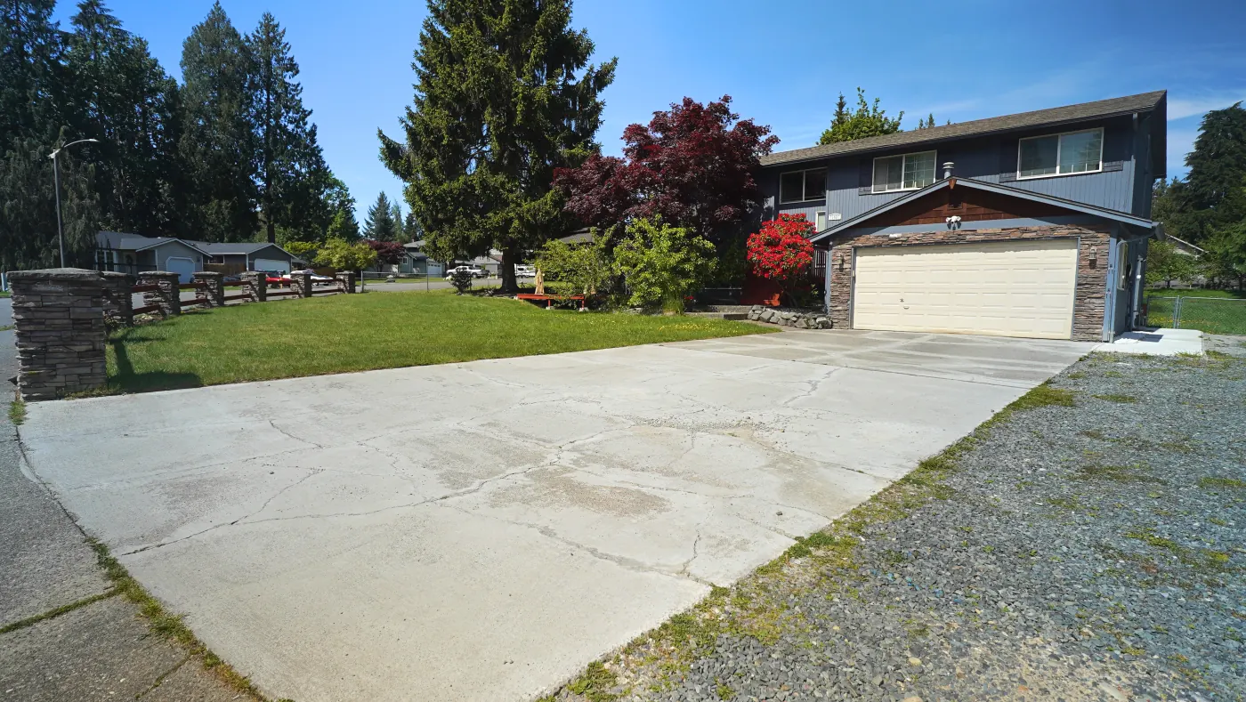 Wide driveway approach to the home