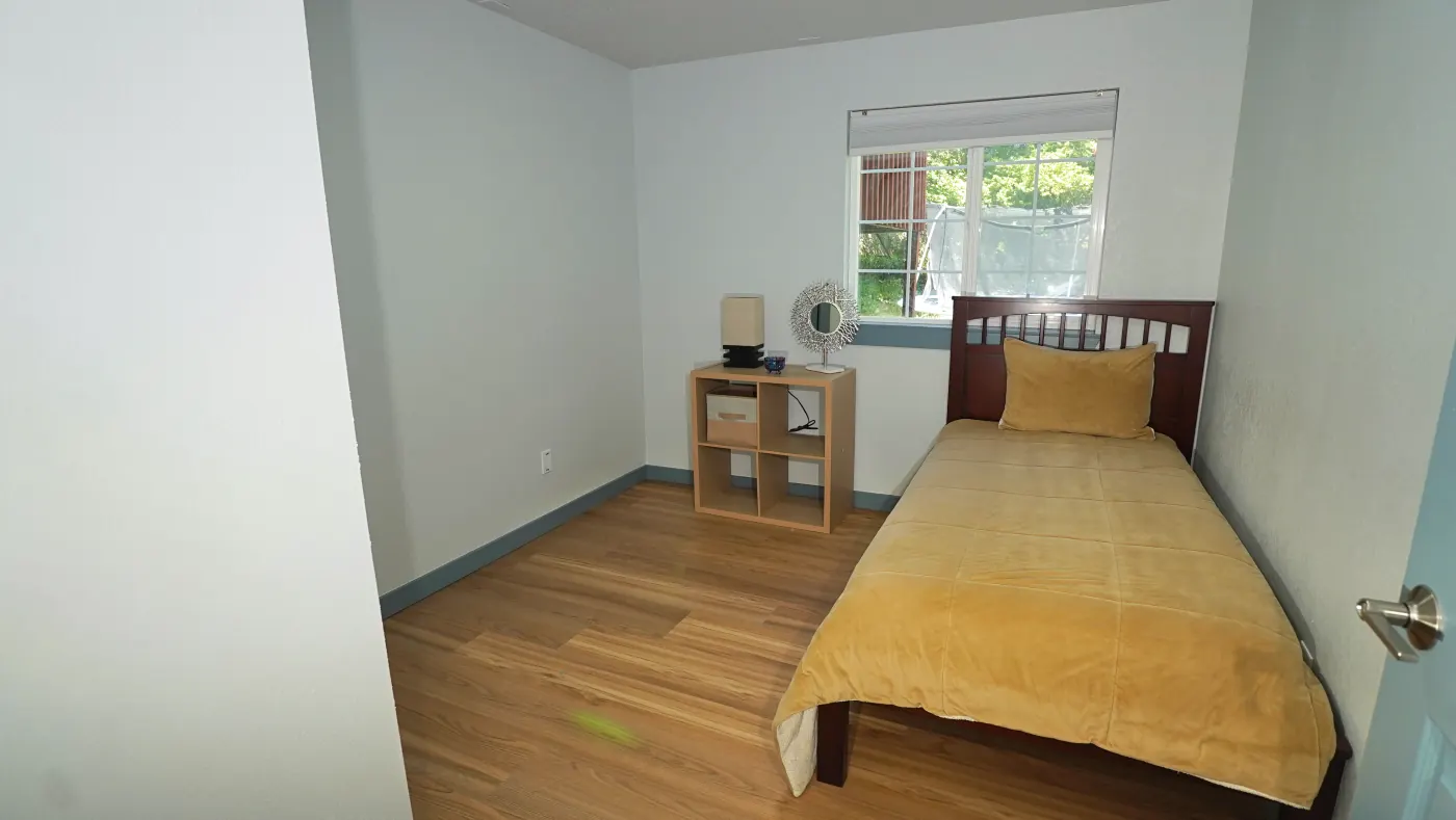 Warm bedroom with personal touches and natural light